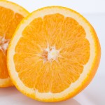 Fresh Orange Halved To Show The Pulp